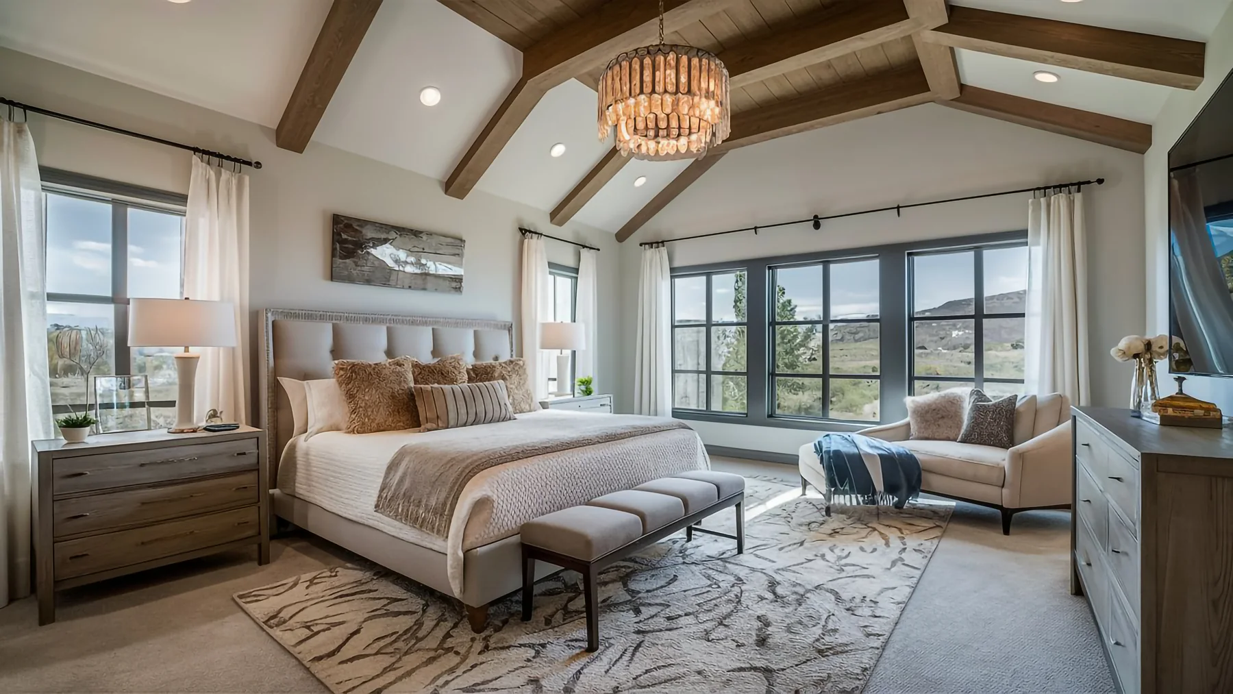 Primary bedroom with exposed beams and a vaulted ceiling