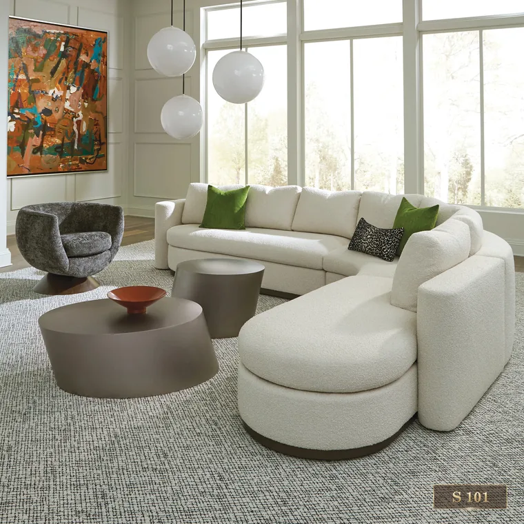 Curved sectional sofa in a bright living room, catalogue reference S 101