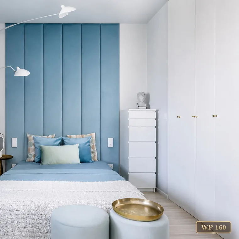 Vertical padded wall panels in blue behind a bed, catalogue reference WP 160