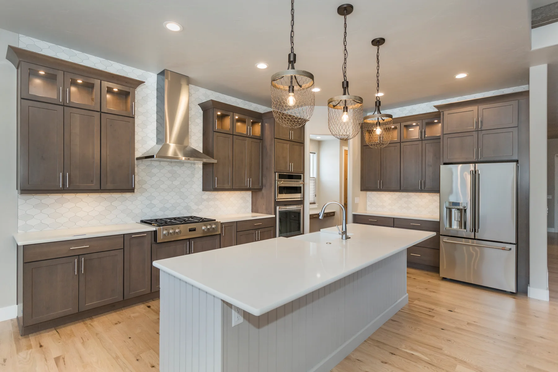 Detail of shaker cabinetry, hood surround and hardware