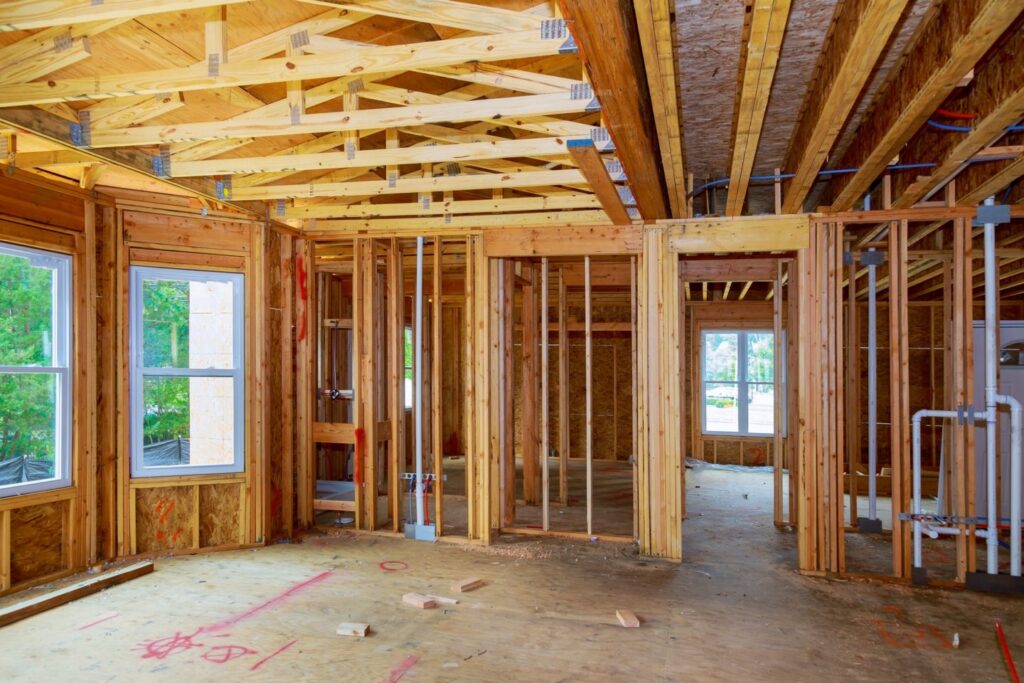 Framing stage of split-level home addition by general contractors in DC.