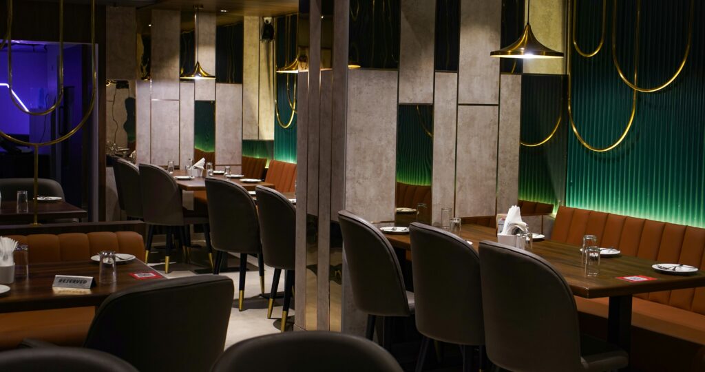 Finished modern bistro-style restaurant in Falls Church, VA with sleek lighting, polished finishes, and layout by expert restaurant contractors.