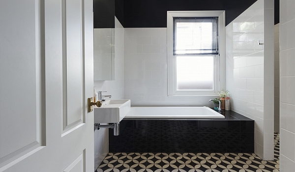 Contemporary bathroom with black and white tiles